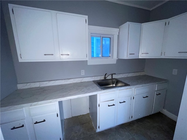 kitchen with white cabinetry and sink