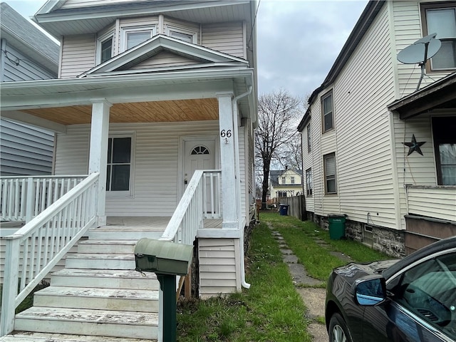 doorway to property featuring covered porch