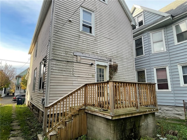 rear view of house with a wooden deck