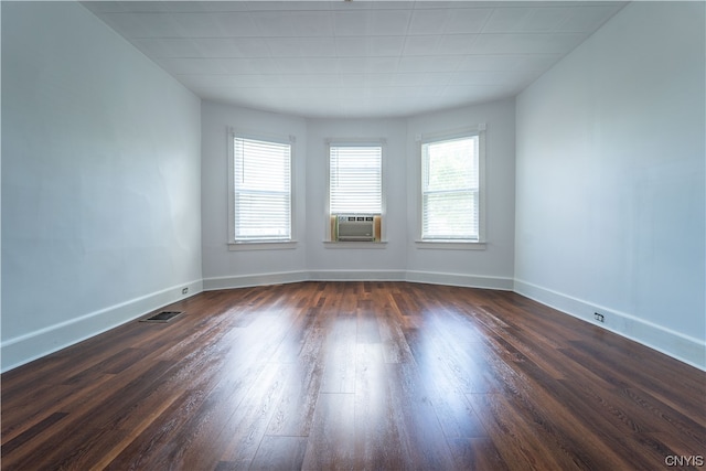 spare room with dark hardwood / wood-style floors