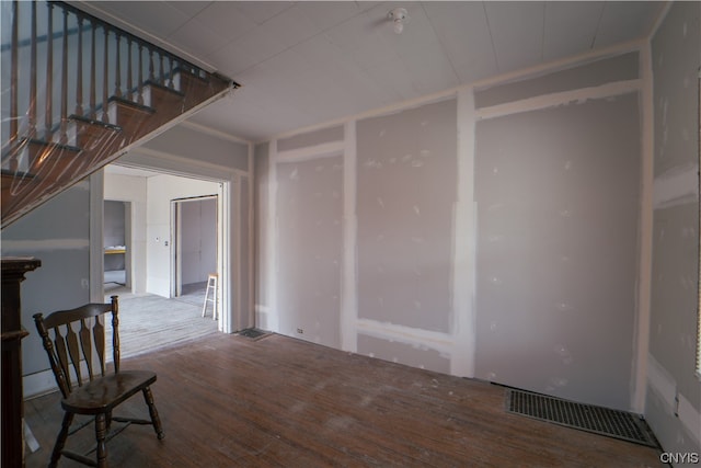 unfurnished room featuring hardwood / wood-style flooring