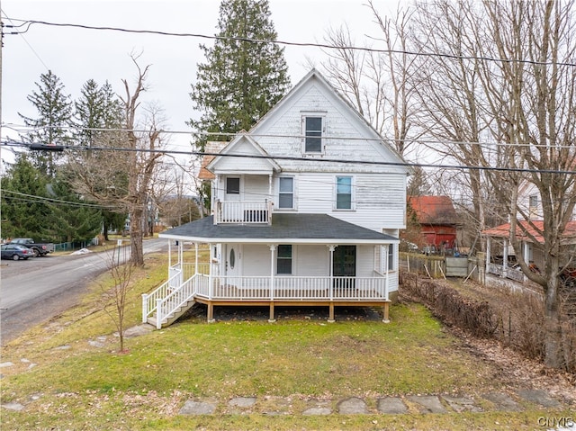 view of front of property featuring a porch and a front lawn