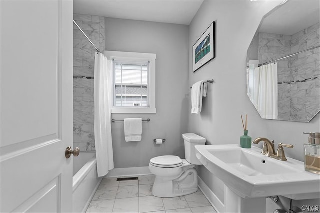 full bathroom with toilet, sink, and shower / bath combo with shower curtain