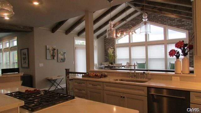 kitchen featuring sink, black appliances, and lofted ceiling with beams