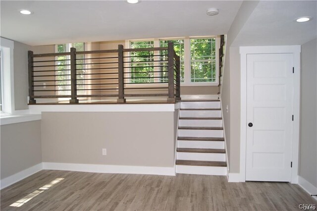 stairway with wood-type flooring