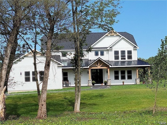 view of front of home with a front lawn and a porch