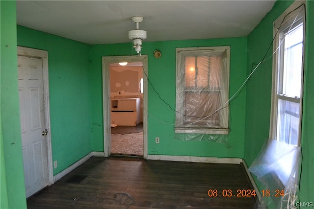 empty room with dark hardwood / wood-style floors