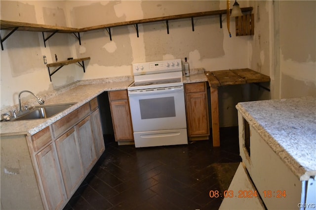 kitchen featuring white electric range oven and sink