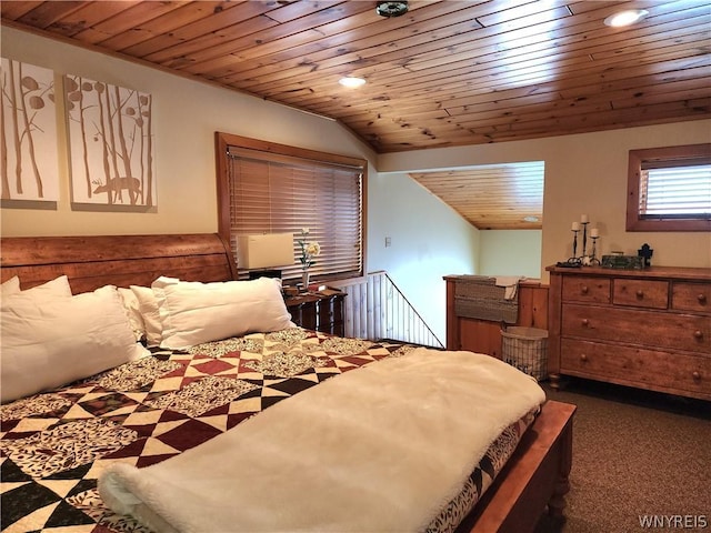 bedroom with dark colored carpet, lofted ceiling, and wooden ceiling