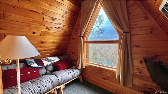 sitting room with wood ceiling, carpet flooring, lofted ceiling, and wooden walls