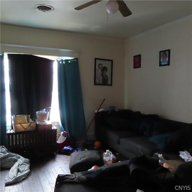 living room with ceiling fan and hardwood / wood-style floors