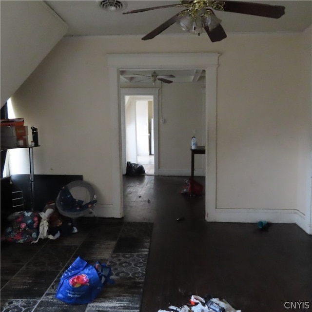 interior space with ceiling fan and wood-type flooring