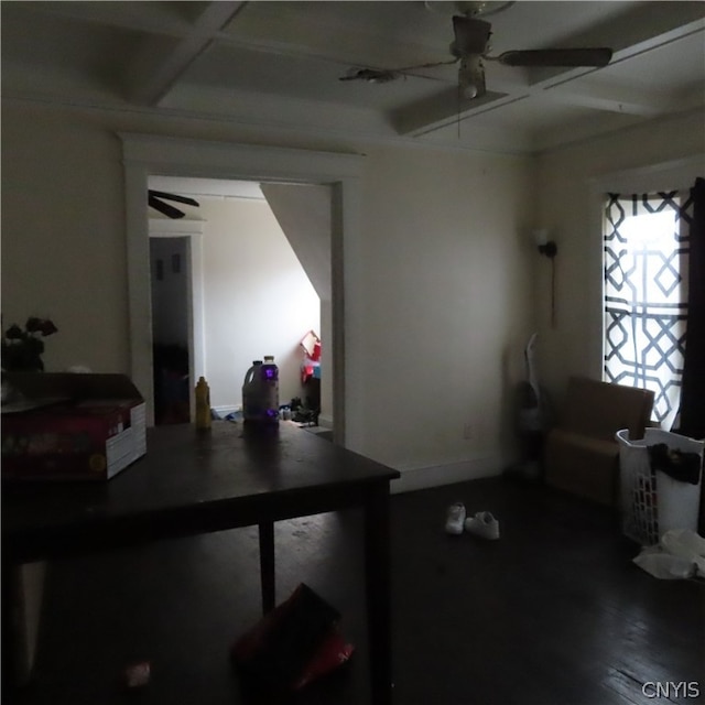 interior space with beam ceiling, coffered ceiling, ceiling fan, and dark wood-type flooring