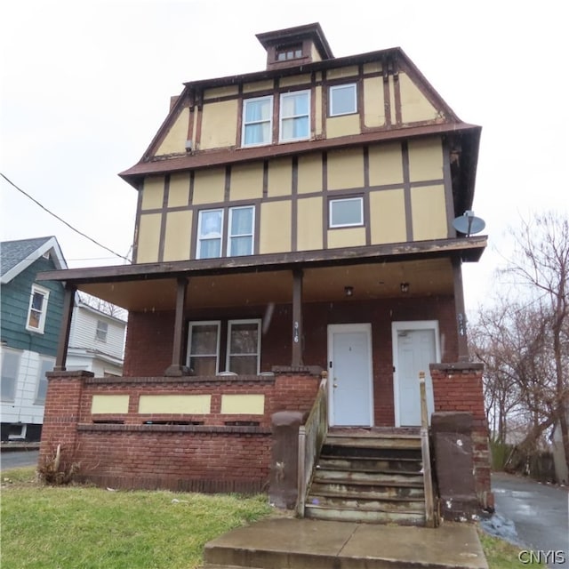 tudor-style house with a porch