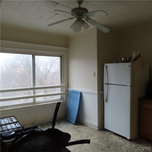 kitchen with light tile floors, ceiling fan, and white refrigerator