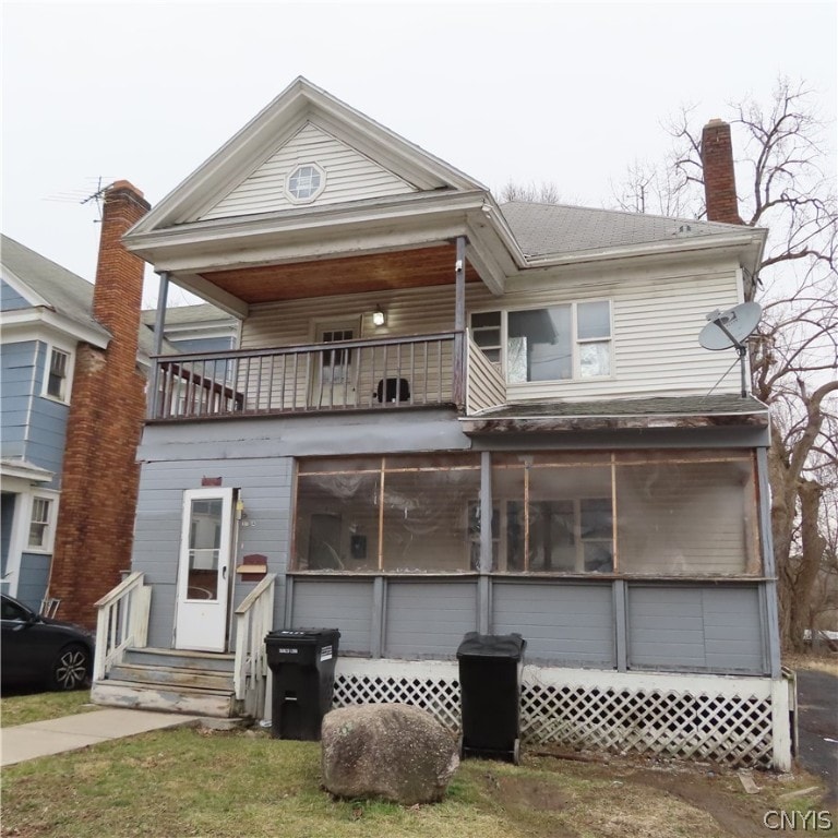 view of front of home with a balcony