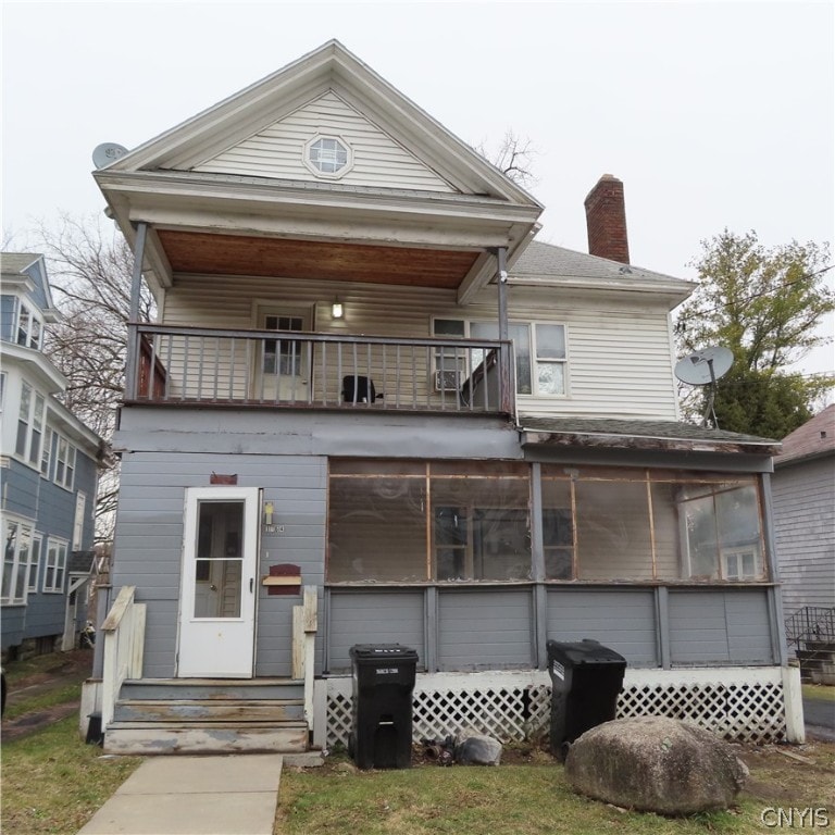 view of front of home with a balcony