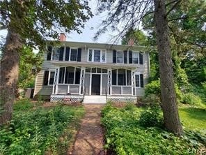 rear view of house with a sunroom