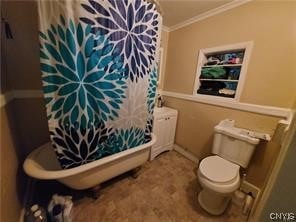 bathroom featuring toilet and ornamental molding