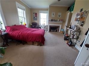 carpeted bedroom with crown molding