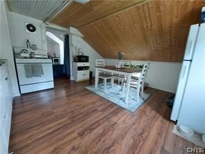 bonus room featuring dark hardwood / wood-style flooring, wood ceiling, and vaulted ceiling