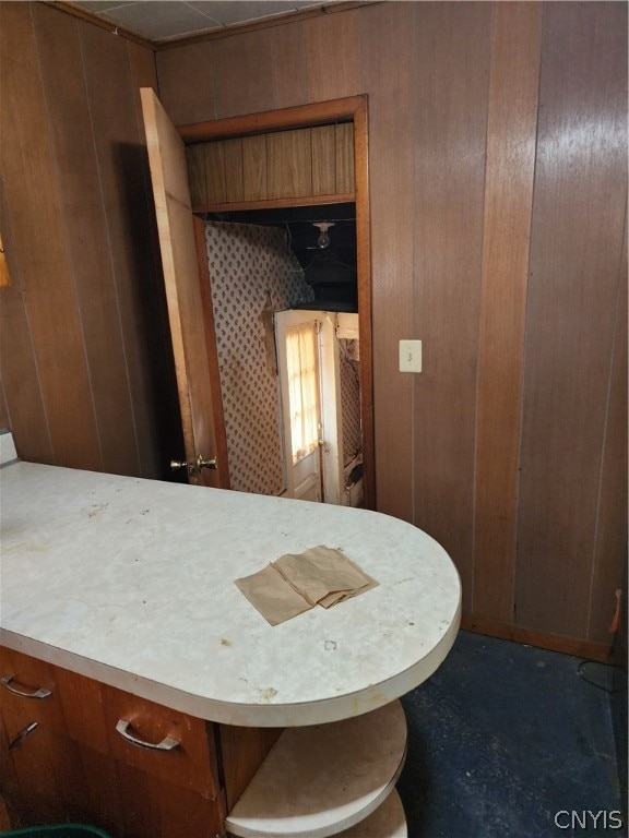 bathroom with vanity and wood walls