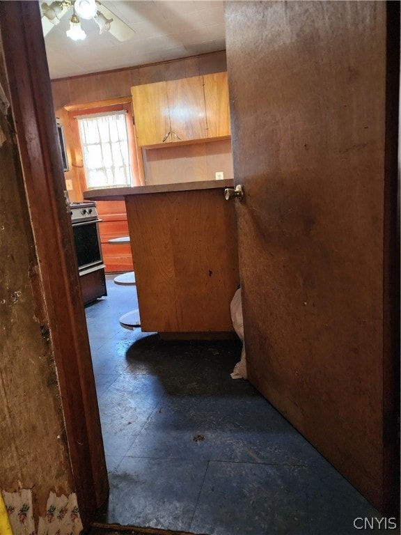 kitchen with electric stove and ceiling fan