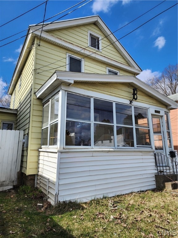 view of home's exterior featuring a sunroom