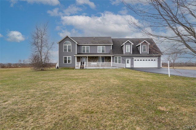 view of front of home featuring a front yard and a garage