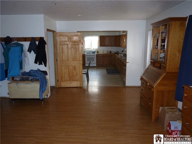 bedroom with dark hardwood / wood-style flooring and sink