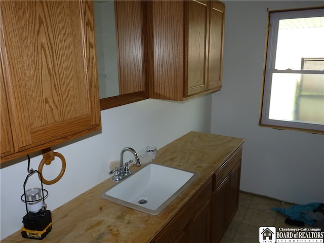 bathroom with sink and tile flooring