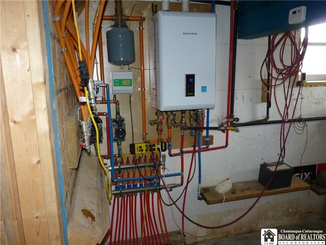 utility room featuring water heater