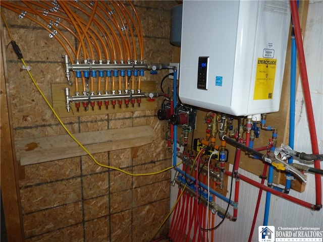 utility room with tankless water heater