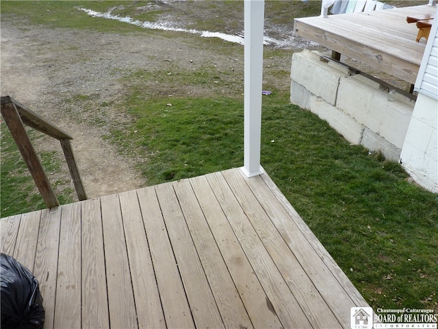 wooden deck with a yard