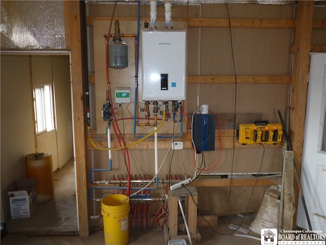 utility room with tankless water heater