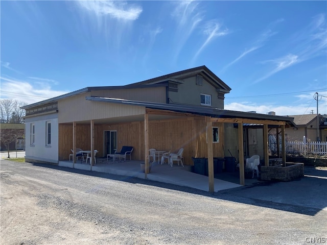 rear view of property with a patio area