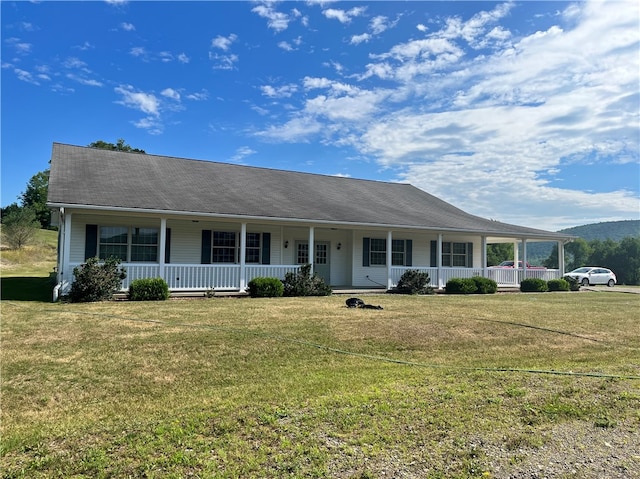 single story home featuring a front lawn and a porch