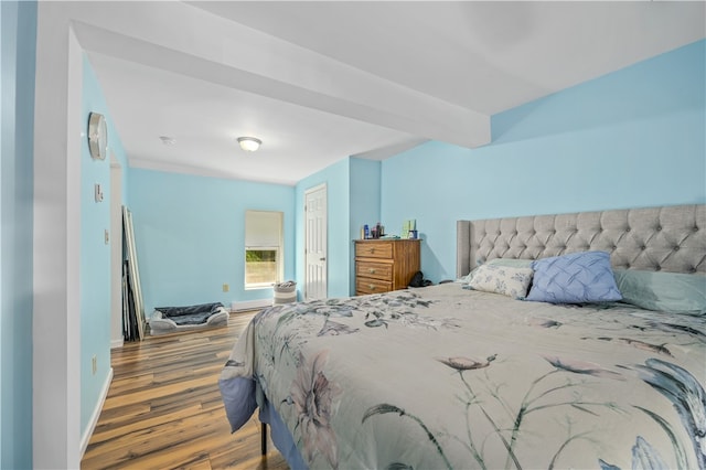 bedroom featuring dark hardwood / wood-style flooring