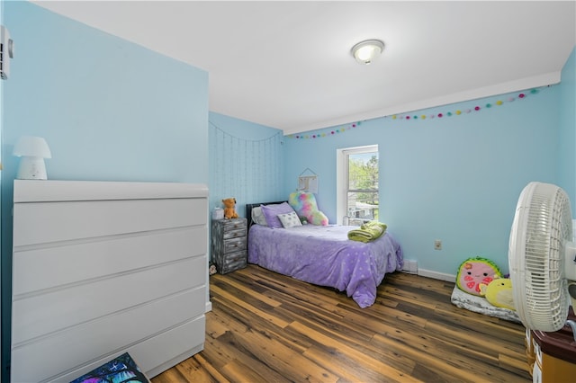 bedroom featuring dark hardwood / wood-style flooring