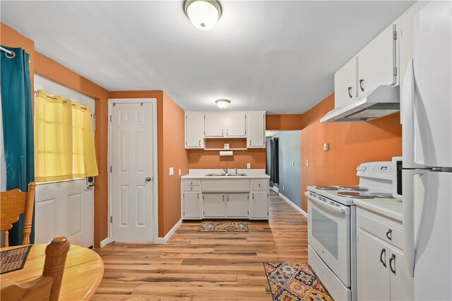 kitchen featuring light hardwood / wood-style flooring, sink, white appliances, and white cabinets