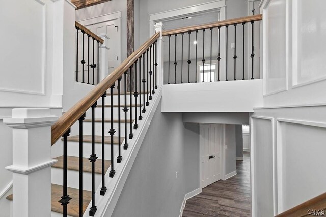 stairway featuring wood-type flooring