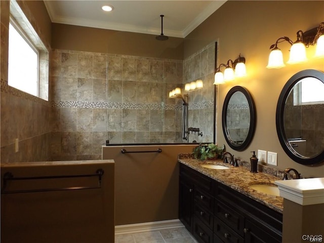 bathroom with ornamental molding, tile patterned flooring, a shower, and vanity