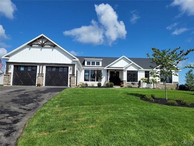 view of front of house with a garage and a front lawn