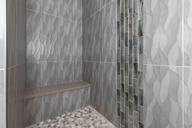 bathroom with a tile shower