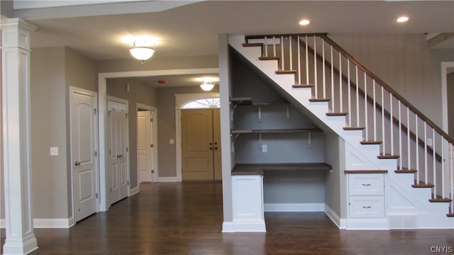 staircase with wood-type flooring