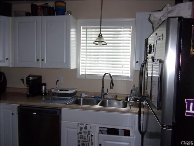 kitchen featuring refrigerator, dishwasher, decorative light fixtures, and white cabinetry