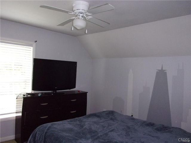 bedroom with lofted ceiling, carpet, and ceiling fan