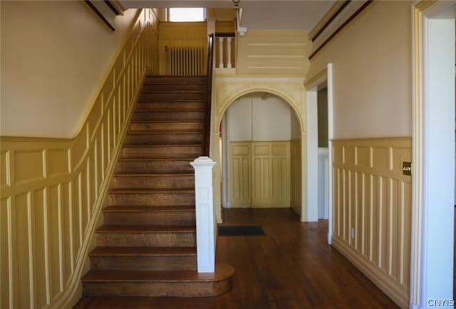 stairway featuring dark hardwood / wood-style flooring