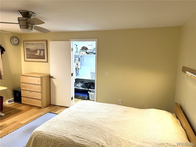 bedroom with ceiling fan and light hardwood / wood-style flooring