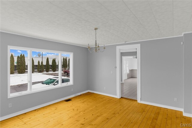 unfurnished dining area featuring light tile patterned flooring and a chandelier